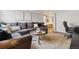 Comfortable living room featuring a cozy sectional sofa and a stylish round coffee table at 1390 N Emerson St # 106, Denver, CO 80218