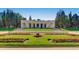 Classical pavilion in park-like setting with flower beds and manicured lawn at 1390 N Emerson St # 106, Denver, CO 80218