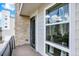 Balcony featuring modern railing, view of the community, and an exterior window and door at 11205 W 53Rd Ln, Arvada, CO 80002