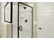 Modern bathroom with glass enclosed shower, and contemporary hardware at 11205 W 53Rd Ln, Arvada, CO 80002