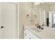 Clean bathroom featuring white countertops, modern fixtures, and ample vanity space at 11205 W 53Rd Ln, Arvada, CO 80002