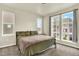 This comfortable bedroom features three windows for natural light and neutral carpeting at 11205 W 53Rd Ln, Arvada, CO 80002