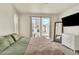 Bright bedroom filled with natural light from large windows offers a tranquil space at 11205 W 53Rd Ln, Arvada, CO 80002