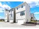 The townhome features a modern exterior, two-car garage, and street parking at 11205 W 53Rd Ln, Arvada, CO 80002