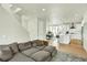Open-concept layout with living room flowing into the dining area and modern kitchen at 11205 W 53Rd Ln, Arvada, CO 80002