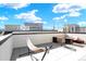 Enjoy the rooftop patio, designed with an outdoor seating area and a hammock with views of the neighborhood at 11205 W 53Rd Ln, Arvada, CO 80002