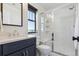 Bright bathroom with a glass-enclosed shower, a modern vanity, and large window at 1280 Gentle Rain Dr, Castle Rock, CO 80109