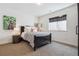 Well-lit bedroom featuring a comfortable bed, stylish decor, and a window with a modern shade at 1280 Gentle Rain Dr, Castle Rock, CO 80109