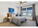 Bright bedroom with a full bed, plush carpet, recessed lights, and great light from the windows at 1280 Gentle Rain Dr, Castle Rock, CO 80109