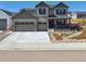 Charming two-story home featuring a welcoming porch and a well-maintained landscaped front yard at 1280 Gentle Rain Dr, Castle Rock, CO 80109