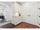 Hallway with built-in storage cabinets, decorative rug, and natural light at 1280 Gentle Rain Dr, Castle Rock, CO 80109