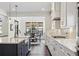 Bright kitchen with a center island, modern appliances, and view of the dining area at 1280 Gentle Rain Dr, Castle Rock, CO 80109