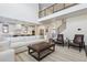 Open-concept living space showcases a modern staircase and connected kitchen at 1280 Gentle Rain Dr, Castle Rock, CO 80109