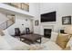 Spacious living room features a fireplace, high ceilings, and sleek modern staircase at 1280 Gentle Rain Dr, Castle Rock, CO 80109