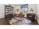 Stylish home office featuring a wooden desk, bookshelf, and natural light at 1280 Gentle Rain Dr, Castle Rock, CO 80109