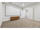 Finished theater room with large screen and adjacent doors leading to other areas of the home at 1280 Gentle Rain Dr, Castle Rock, CO 80109