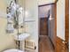 Bathroom featuring pedestal sink, vintage mirror, and vintage radiator at 125 E 11Th Ave # 2, Denver, CO 80203