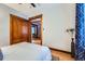 Bedroom with hardwood floors, closet and view of another room at 125 E 11Th Ave # 2, Denver, CO 80203