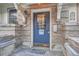 Charming brick building entrance showcases a blue door with glass pane, and the address 125 on E. 11th Ave at 125 E 11Th Ave # 2, Denver, CO 80203
