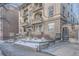 Charming brick apartment building featuring multiple balconies, arched entryways, and landscaped surroundings for a welcoming curb appeal at 125 E 11Th Ave # 2, Denver, CO 80203