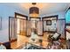 Bright living room features a decorative rug, modern coffee table, and unique curtains framing the kitchen and office at 125 E 11Th Ave # 2, Denver, CO 80203