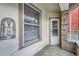 Covered porch with tile flooring and exterior window at 125 E 11Th Ave # 2, Denver, CO 80203