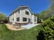 Exterior of home featuring a well-maintained lawn, patio, and large windows for natural light at 5352 Brookside Dr, Broomfield, CO 80020