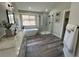 Modern bathroom includes free standing tub, glass shower and white cabinets at 5352 Brookside Dr, Broomfield, CO 80020