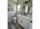 Bright bathroom boasts a white cabinet, dark hardware and modern sink at 5352 Brookside Dr, Broomfield, CO 80020