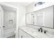 Bathroom featuring shower, granite countertops, and modern fixtures at 5352 Brookside Dr, Broomfield, CO 80020