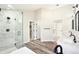 Spa-like bathroom features a soaking tub and walk-in glass shower at 5352 Brookside Dr, Broomfield, CO 80020
