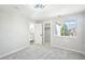 Bright bedroom features neutral paint, plush carpet, a bathroom, and a walk-in closet at 5352 Brookside Dr, Broomfield, CO 80020