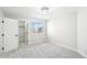 Bright bedroom featuring a walk-in closet and a large window at 5352 Brookside Dr, Broomfield, CO 80020