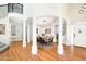 Spacious dining room featuring hard wood floors and a dining table set for six at 5352 Brookside Dr, Broomfield, CO 80020