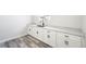 Laundry area with ample storage cabinets and modern hardware at 5352 Brookside Dr, Broomfield, CO 80020