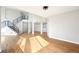 Open living room with hardwood floors, modern staircase, and elegant archways at 5352 Brookside Dr, Broomfield, CO 80020