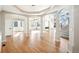 Bright and airy living room featuring hardwood floors and elegant lighting at 5352 Brookside Dr, Broomfield, CO 80020