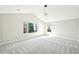 Bright main bedroom features neutral paint, plush carpet, and natural light at 5352 Brookside Dr, Broomfield, CO 80020