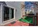 Wooden deck features sliding glass door to interior and view of landscaped yard at 11605 E Cornell Cir, Aurora, CO 80014