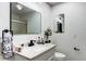 Stylish bathroom boasts modern fixtures, a stone counter, and decorative mirrors and plants at 11605 E Cornell Cir, Aurora, CO 80014
