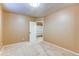 Neutral bedroom featuring a closet with shelving at 11605 E Cornell Cir, Aurora, CO 80014