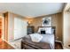 Bedroom features a wood frame bed, hardwood floors, closet and decorative artwork at 11605 E Cornell Cir, Aurora, CO 80014