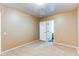 Neutral bedroom with door leading to bathroom at 11605 E Cornell Cir, Aurora, CO 80014