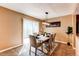 Bright dining room featuring a white table, comfortable seating, and sliding glass doors for easy outdoor access at 11605 E Cornell Cir, Aurora, CO 80014