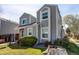 Two-story exterior showcasing gray siding and well-maintained landscaping at 11605 E Cornell Cir, Aurora, CO 80014