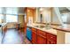 Functional kitchen area with wooden cabinets, sleek countertops, stainless steel appliances, and a breakfast nook at 11605 E Cornell Cir, Aurora, CO 80014