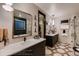 Spa-like bathroom with double sinks, a large mirror, and a walk-in shower at 1774 Peak Loop, Broomfield, CO 80023