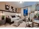 Stylish bedroom with a daybed, workspace, and window seat at 1774 Peak Loop, Broomfield, CO 80023