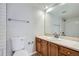 Clean bathroom with single vanity and shower/tub combo at 12136 E 2Nd Dr, Aurora, CO 80011