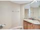 Bathroom with granite countertop vanity and wood cabinet at 12136 E 2Nd Dr, Aurora, CO 80011